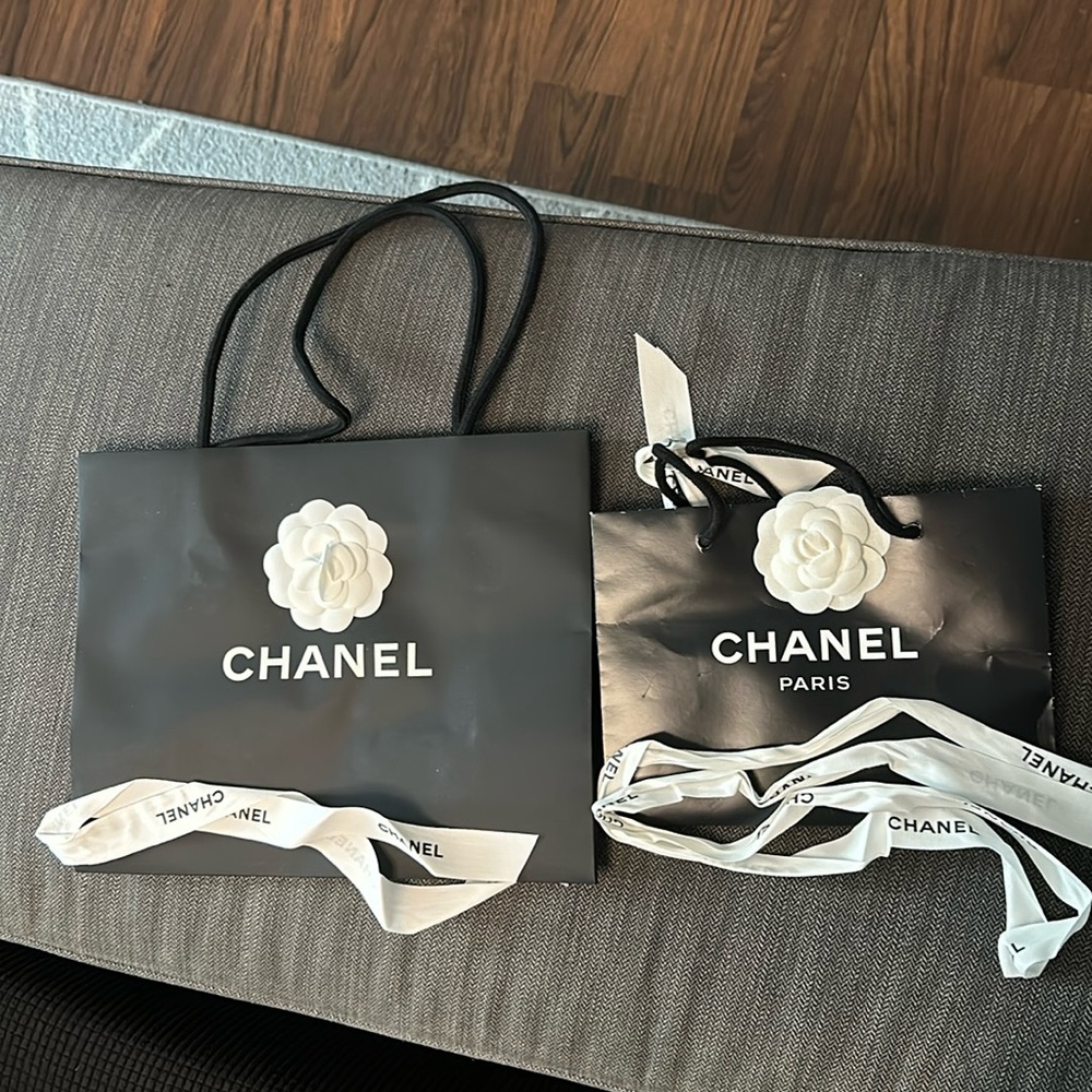 Two Chanel shopping bags with ribbon